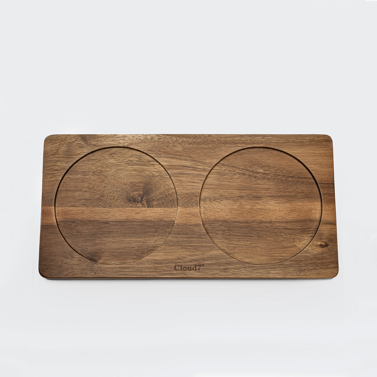 Cloud7 solid acacia wood dog feeding station with non-slip laser-cut perforated bowl slots.