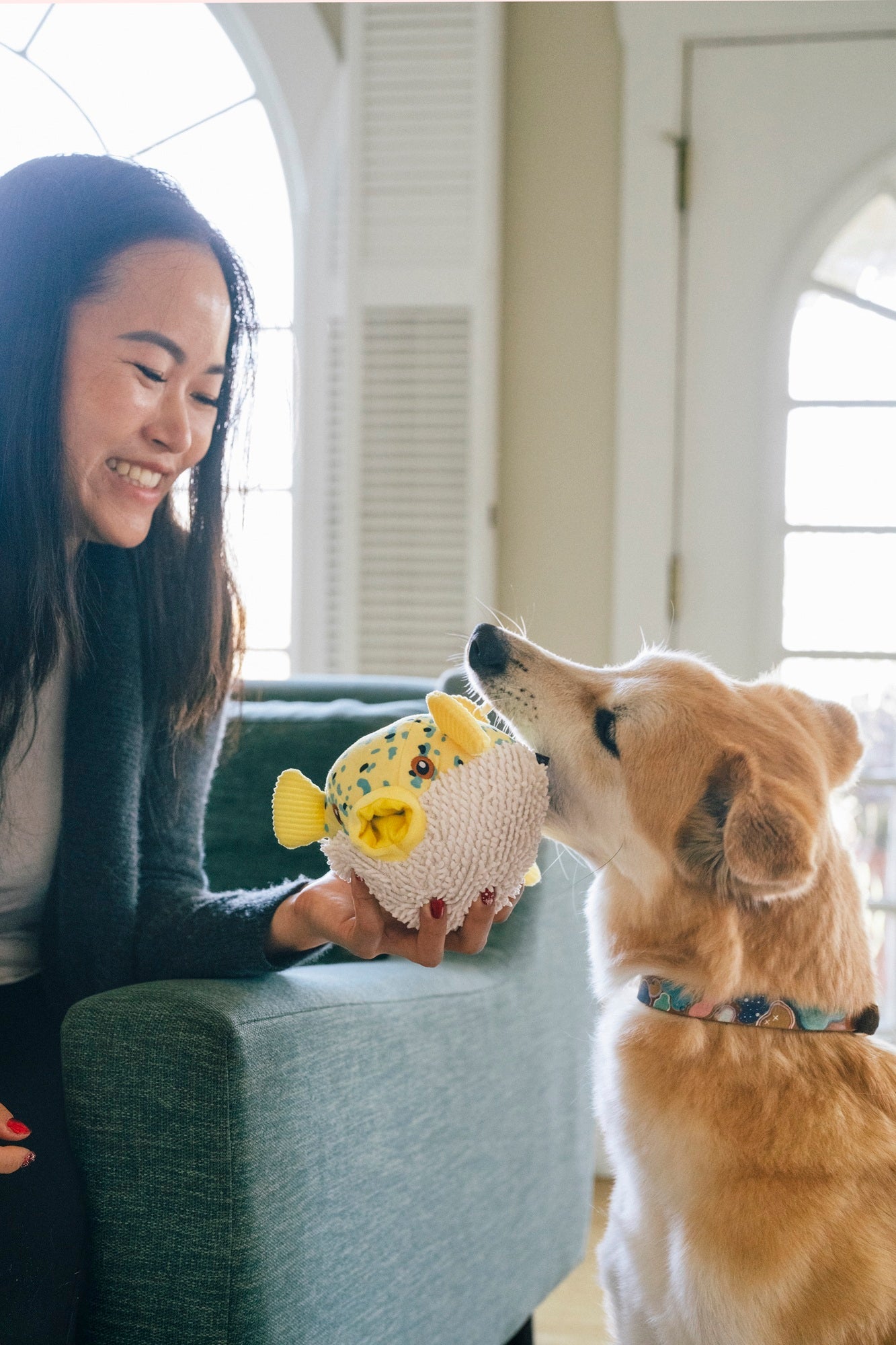 P.L.A.Y. Ocean Buddies Puffer Fish interactive squeaky plush dog toy in a round, spiky-textured design.