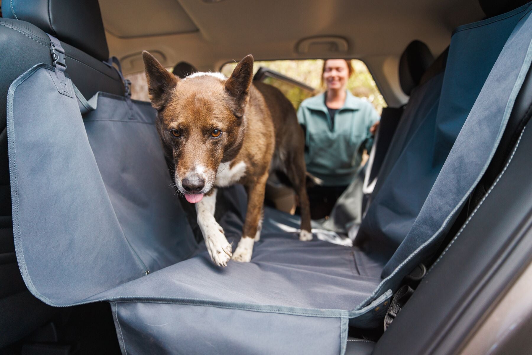 Ruffwear Dirtbag dog car seat cover installed as a cozy backseat hammock to keep muddy adventure pups safe